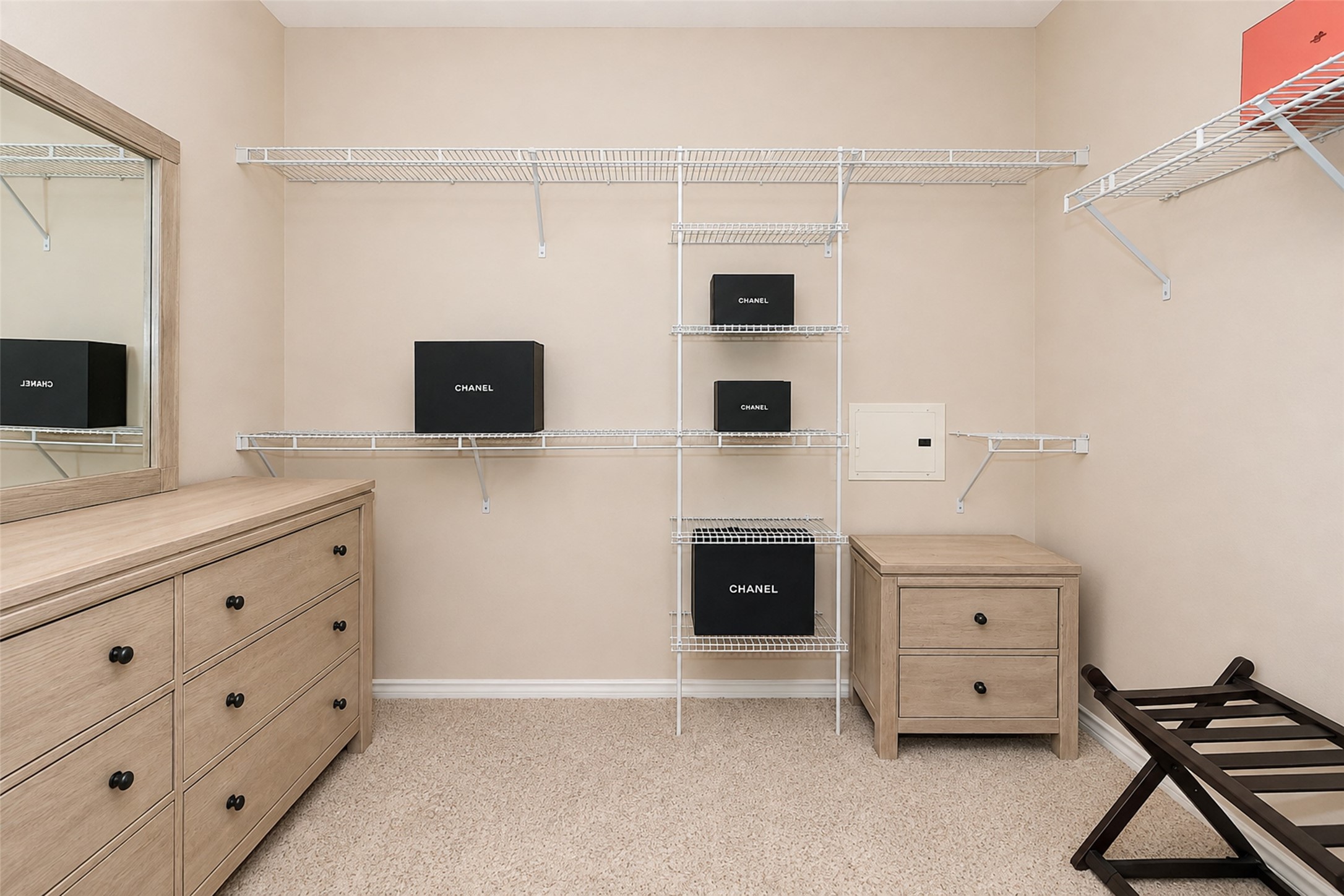 2400 McCue Road, Unit 401 Houston, TX 77056 - Photo 16 of 47 Primary bedroom closet with dressers, mirror and a clothes steamer. Home is fully furnished.
