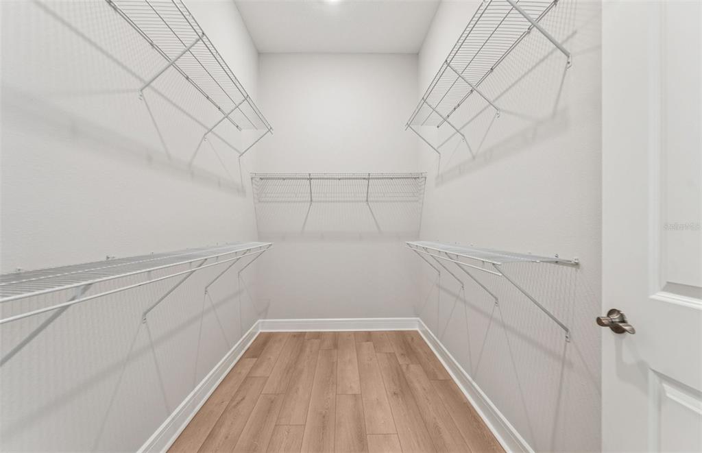 5230 Southwest 88th Circle Ocala, FL 34481 - Photo 11 of 35 a view of a room with racks on the wall