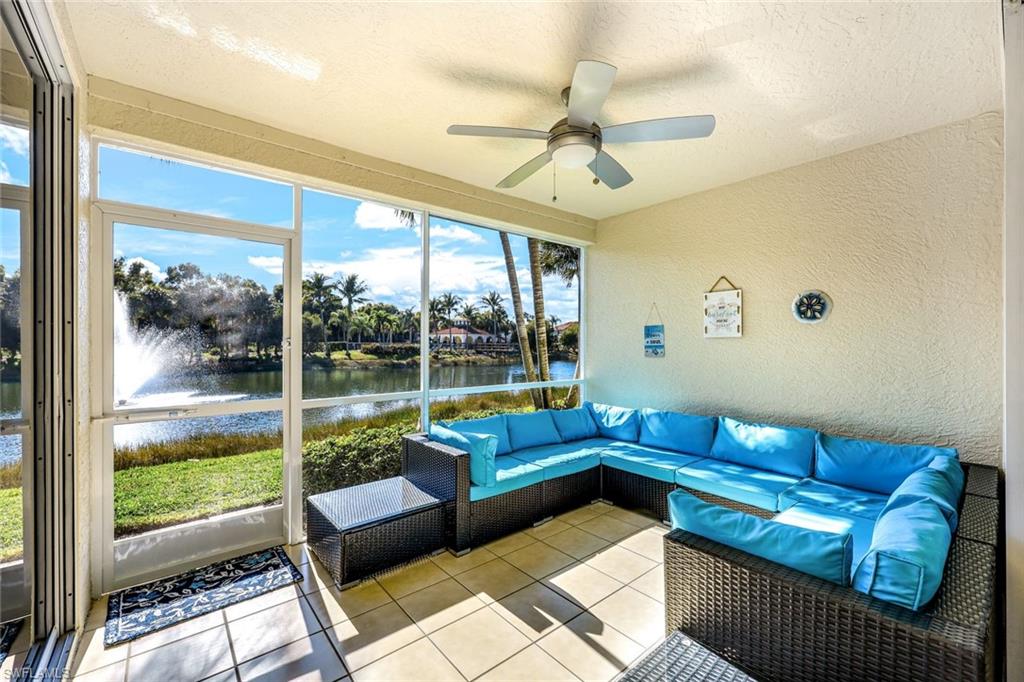 10921 Santa Margherita Road, Unit 103 Estero, FL 34135 - Photo 2 of 38 a living room with furniture and a large window