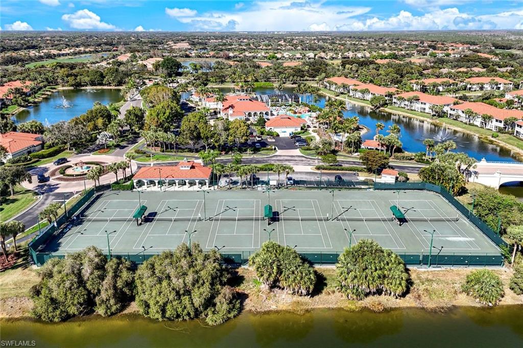 10921 Santa Margherita Road, Unit 103 Estero, FL 34135 - Photo 22 of 38 an aerial view of residential houses with outdoor space