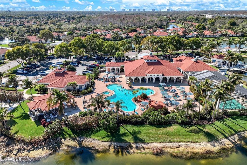 10921 Santa Margherita Road, Unit 103 Estero, FL 34135 - Photo 24 of 38 an aerial view of residential houses with outdoor space and lake view