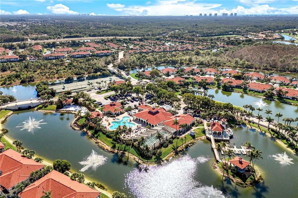 10921 Santa Margherita Road, Unit 103 Estero, FL 34135 - Photo 25 of 38 an aerial view of residential houses with outdoor space