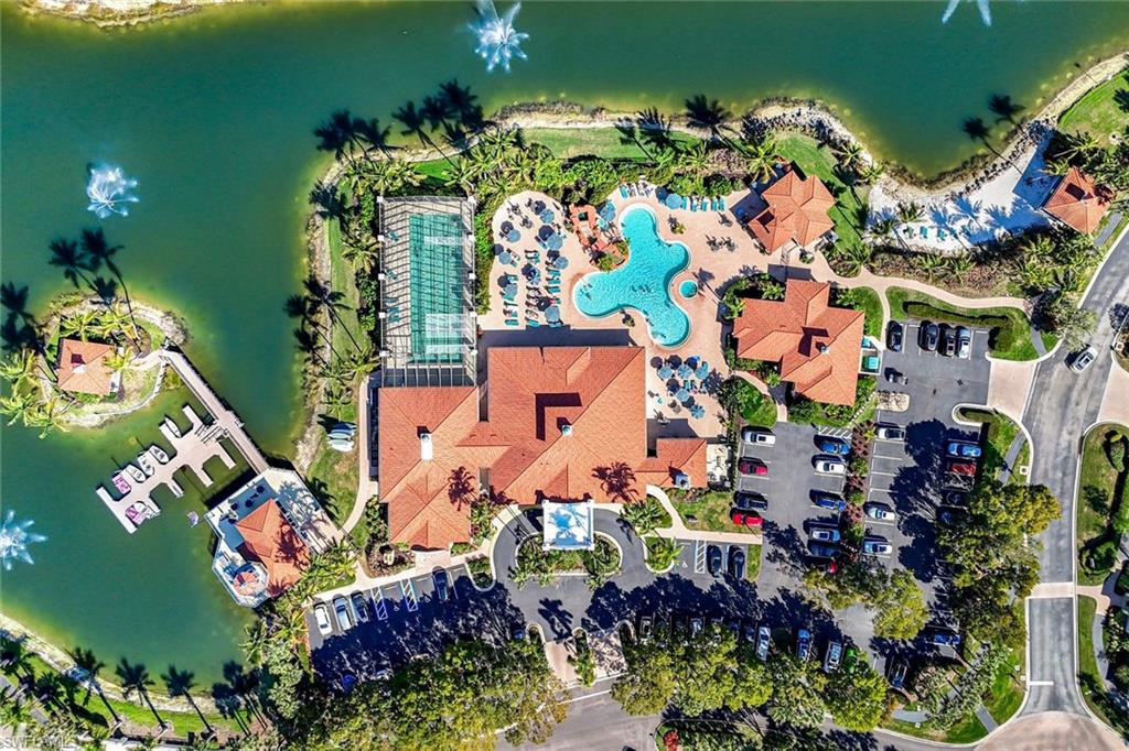 10921 Santa Margherita Road, Unit 103 Estero, FL 34135 - Photo 26 of 38 an aerial view of a house a yard and a fountain
