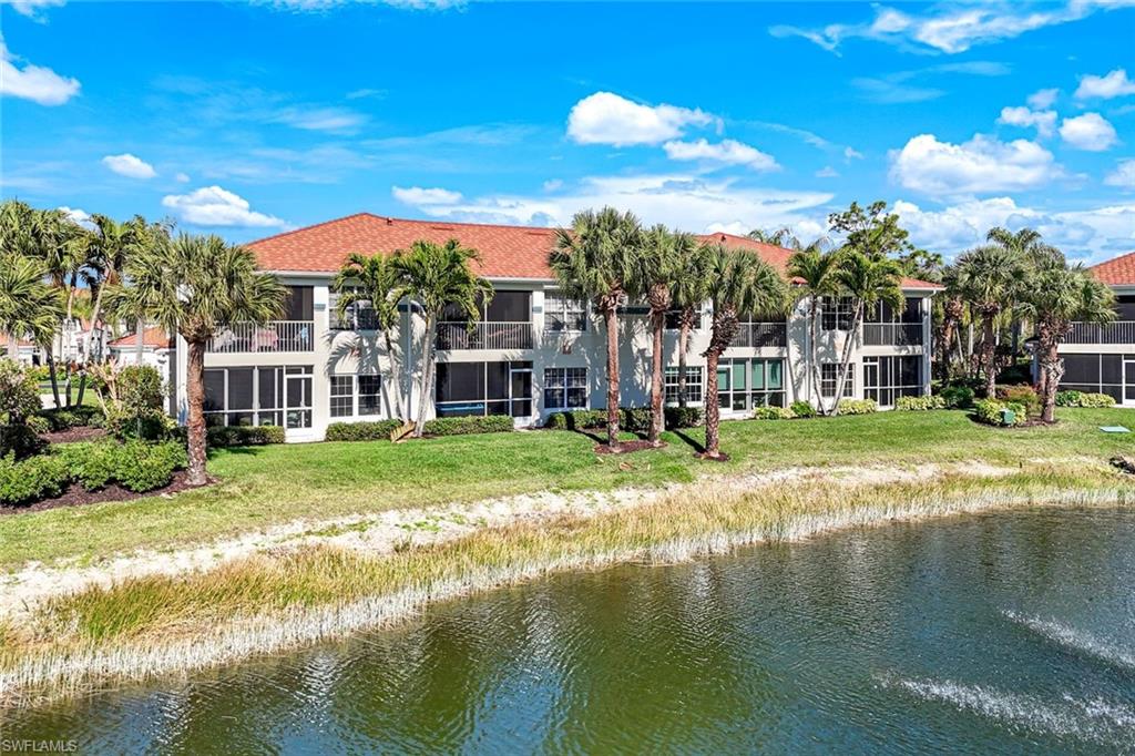 10921 Santa Margherita Road, Unit 103 Estero, FL 34135 - Photo 31 of 38 a view of lake with a house in the background