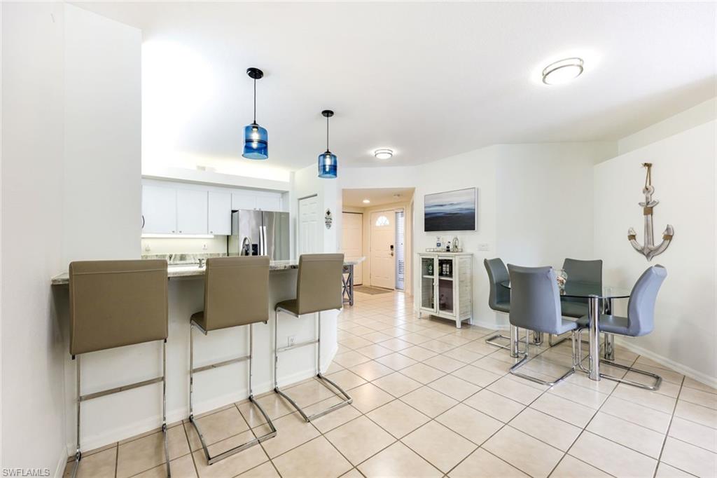 10921 Santa Margherita Road, Unit 103 Estero, FL 34135 - Photo 10 of 38 a view of kitchen with breakfast area