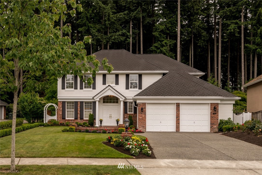 3014 215th Street Southeast Bothell, WA 98021 - Photo 1 of 1 front view of a house with a yard