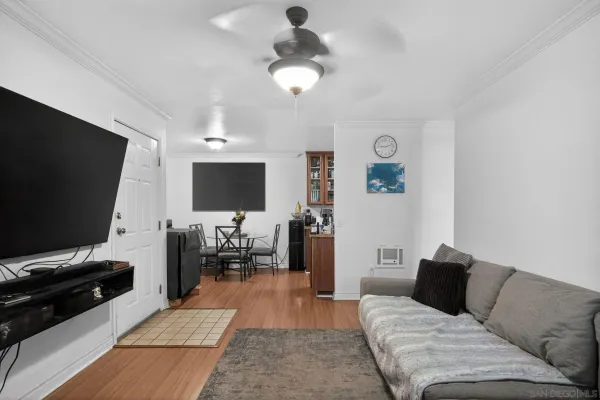 a living room with furniture and a flat screen tv