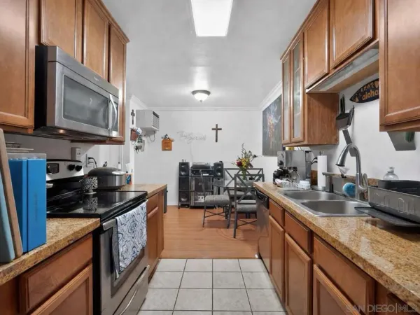 a kitchen that has a sink and a stove
