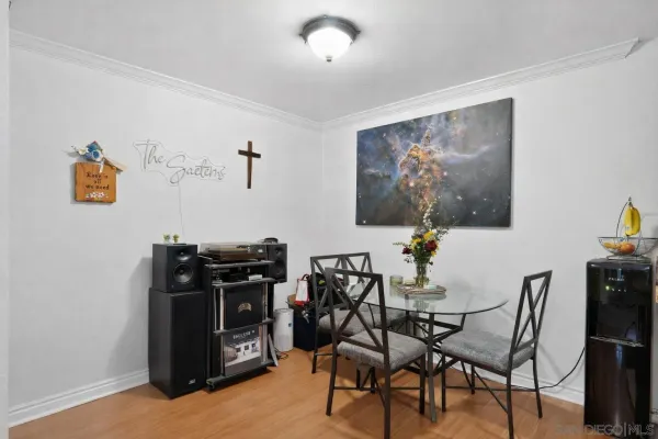 a view of a dining room with furniture and wooden floor