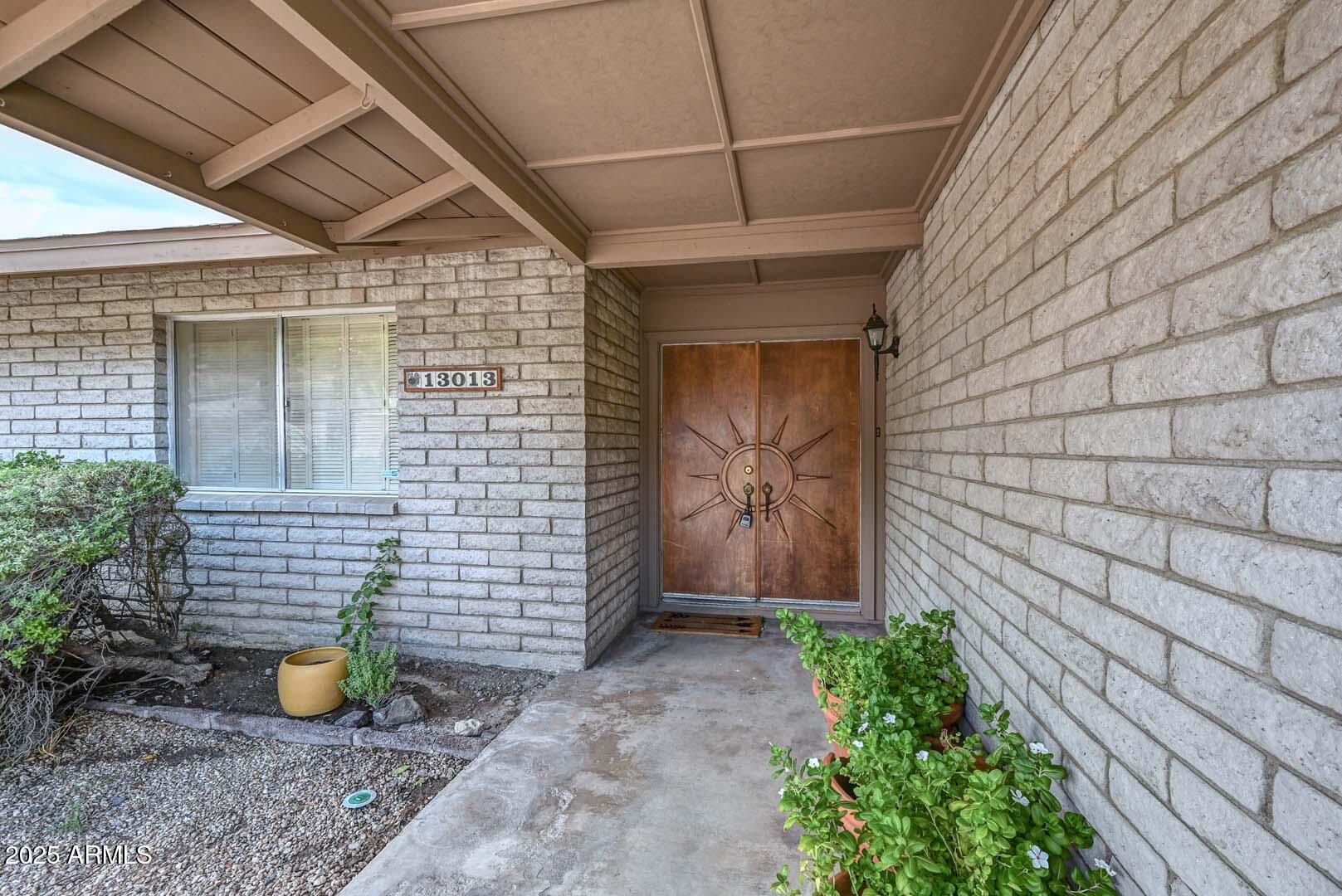 13013 North Surrey Circle Phoenix, AZ 85029 - Photo 4 of 36 a view of outdoor space with porch