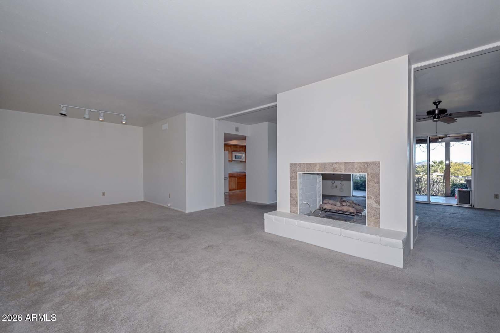 13013 North Surrey Circle Phoenix, AZ 85029 - Photo 6 of 36 a view of empty room with a fireplace