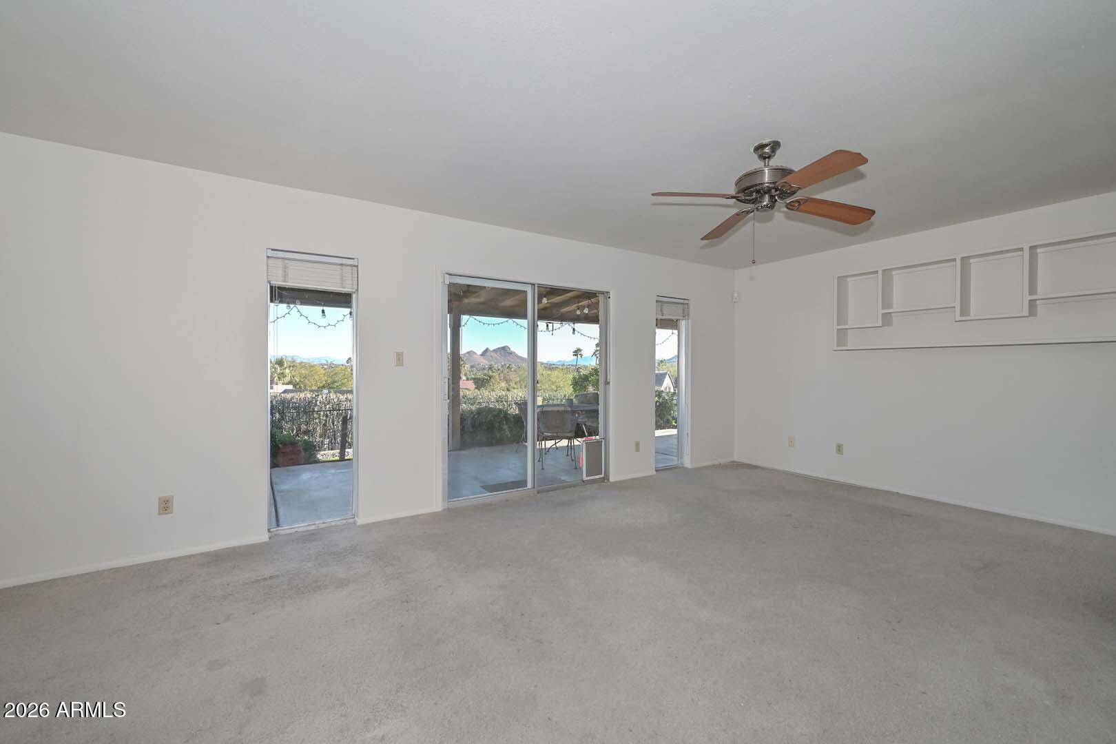 13013 North Surrey Circle Phoenix, AZ 85029 - Photo 9 of 36 a view of an empty room with a window