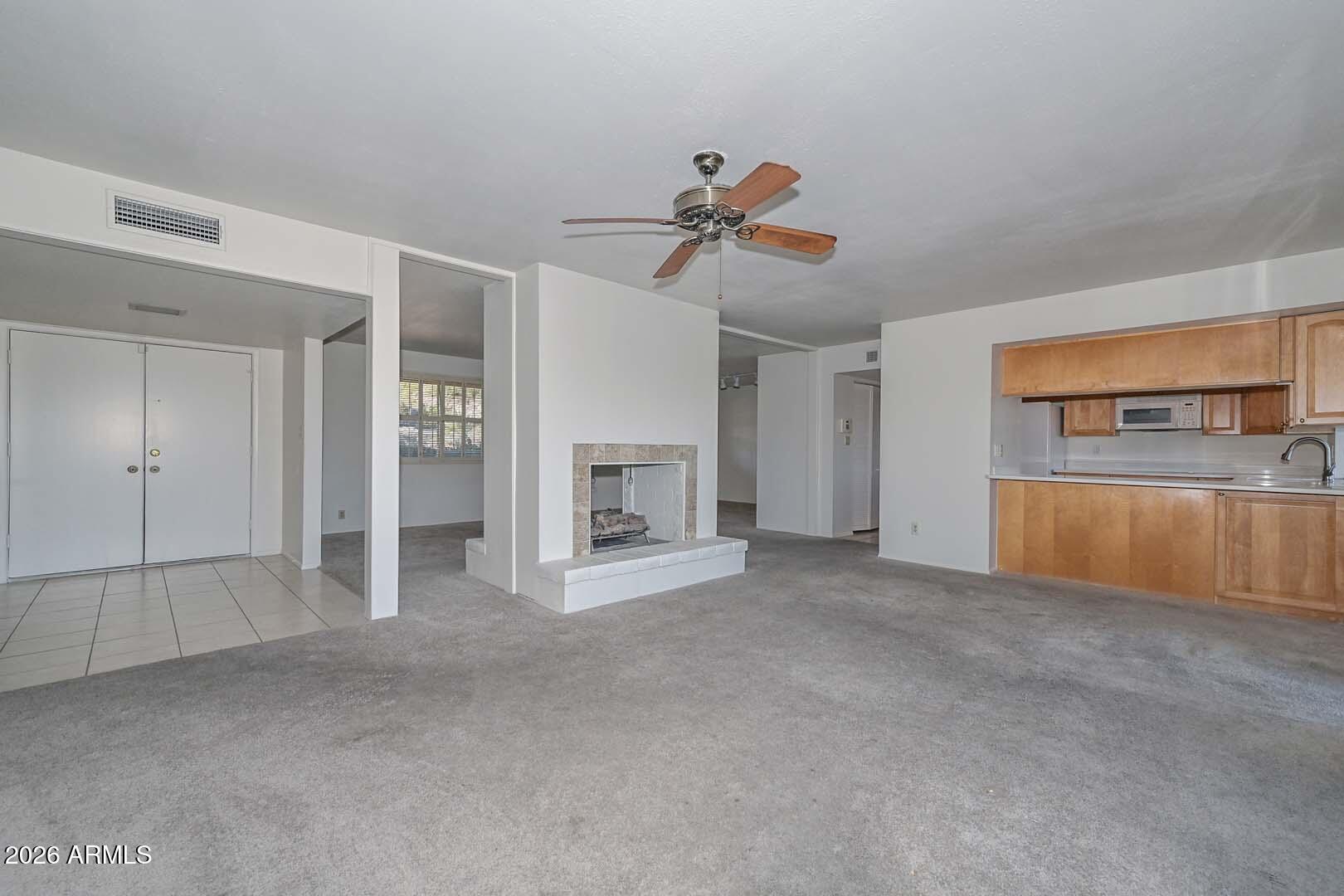 13013 North Surrey Circle Phoenix, AZ 85029 - Photo 10 of 36 a view of empty room with a fireplace