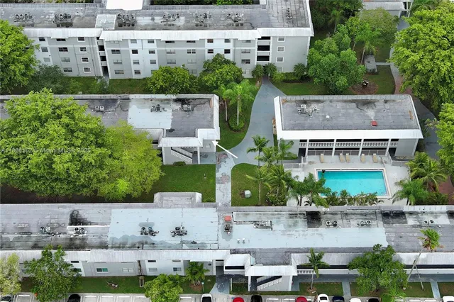 an aerial view of city parking and river