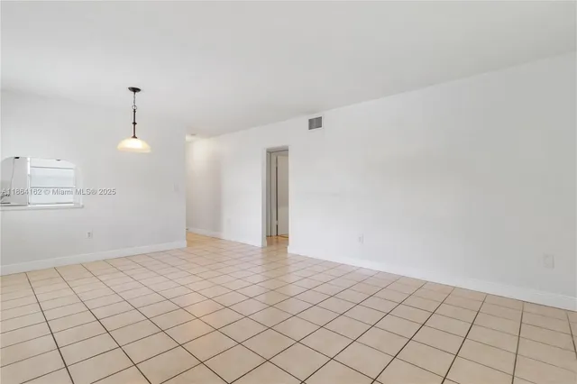 a view of an empty room and window