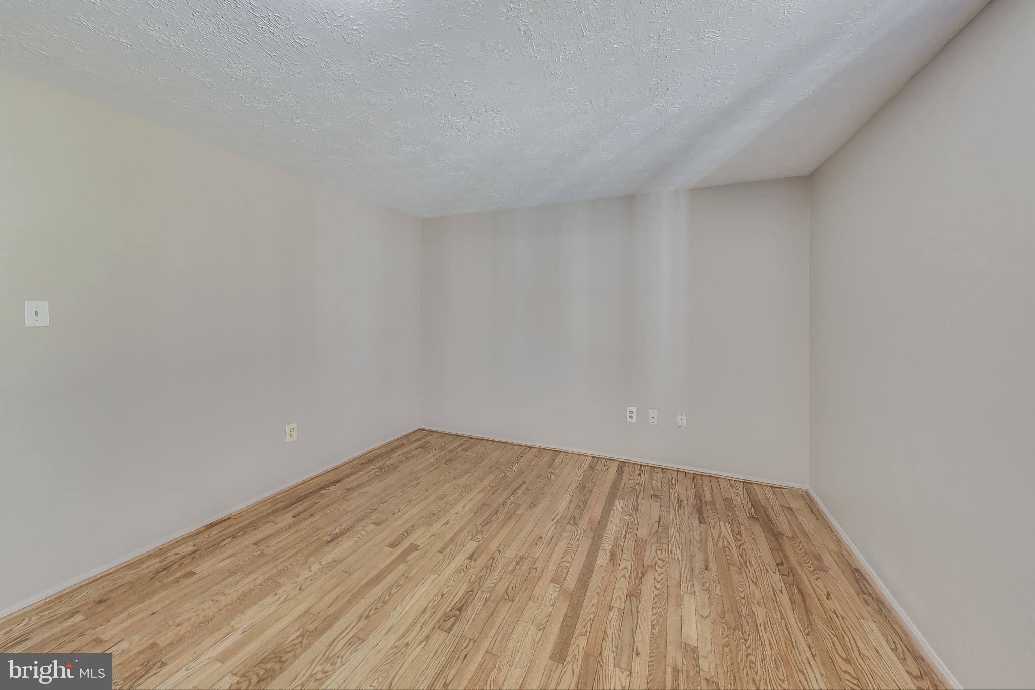 9217 Briarchip Street Laurel, MD 20708 - Photo 17 of 45 a view of empty room with wooden floor