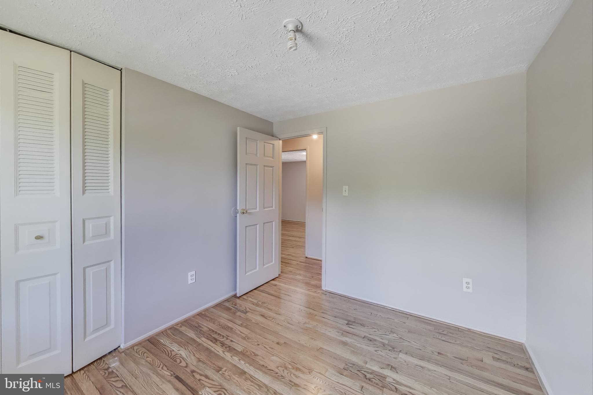 9217 Briarchip Street Laurel, MD 20708 - Photo 23 of 45 a view of an empty room with closet and a window