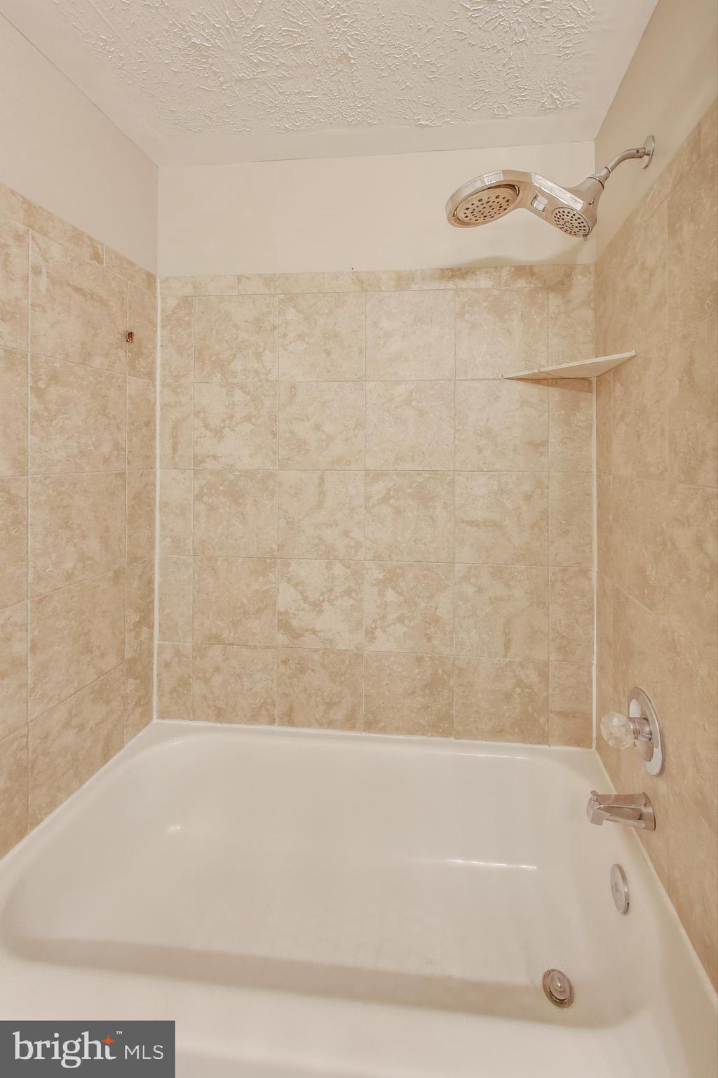 9217 Briarchip Street Laurel, MD 20708 - Photo 25 of 45 a bathroom with a bathtub
