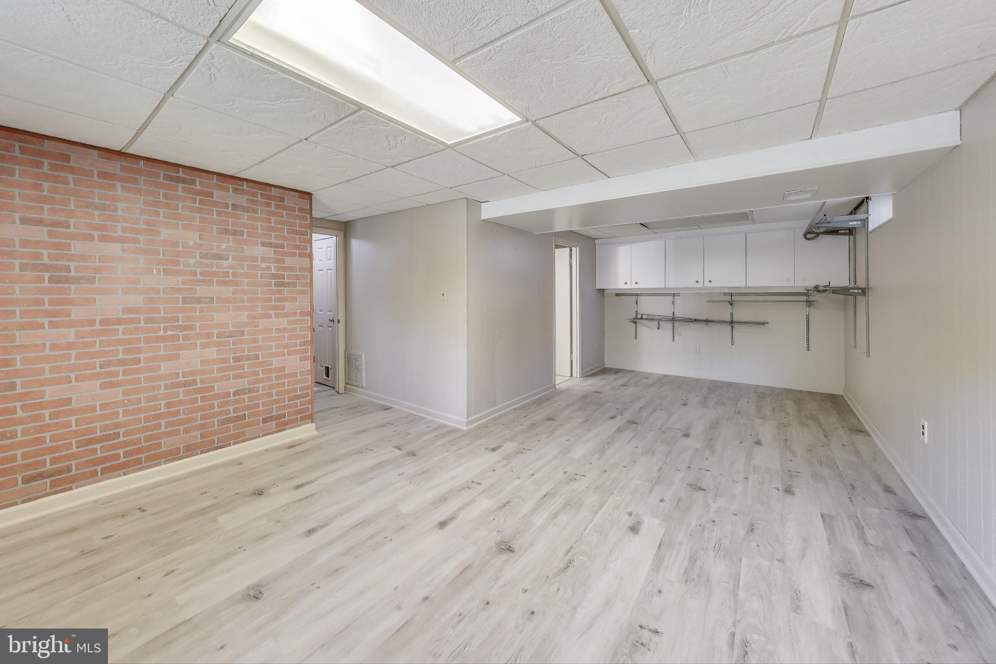 9217 Briarchip Street Laurel, MD 20708 - Photo 27 of 45 a view of empty room with wooden floor