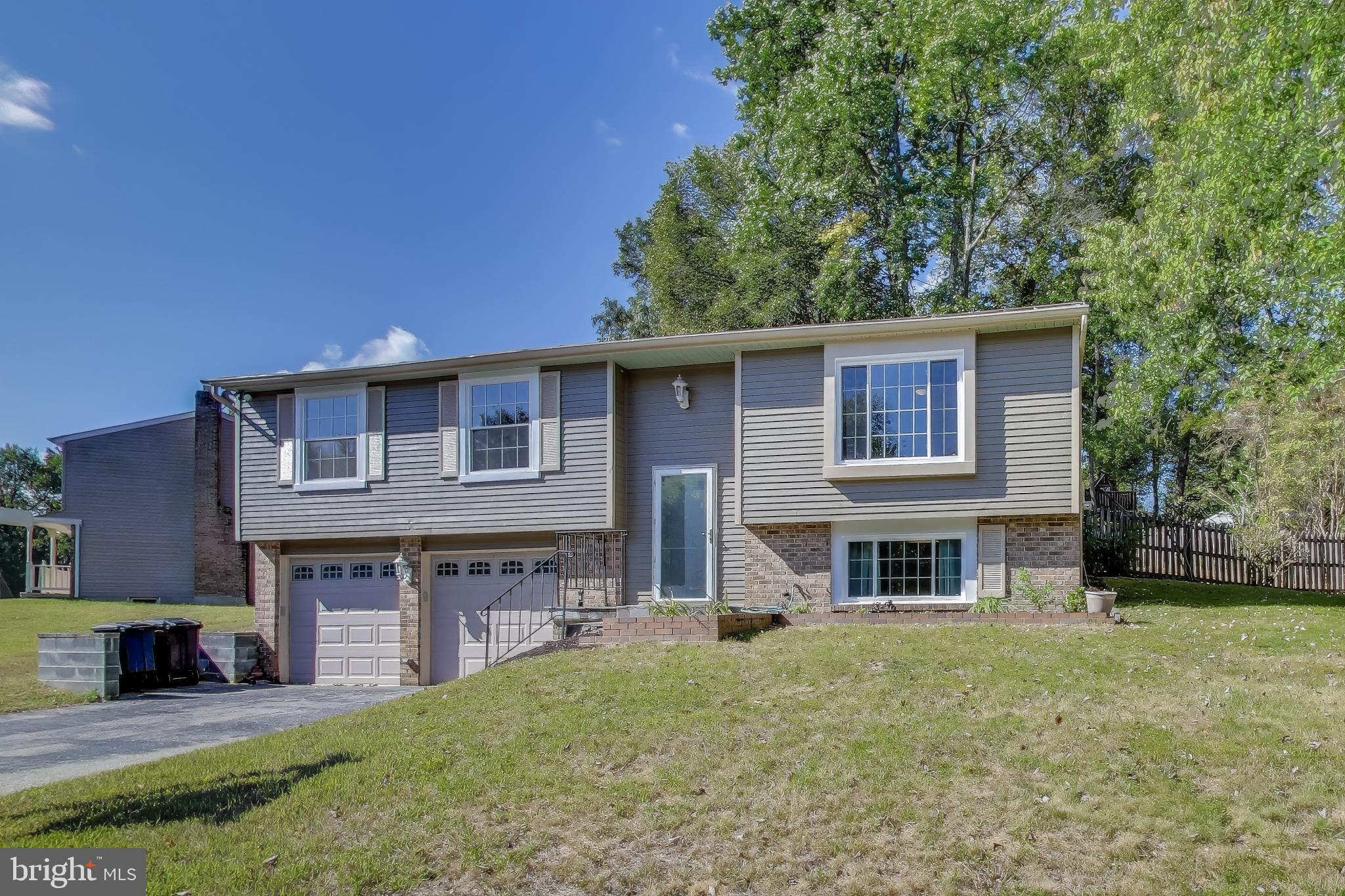 9217 Briarchip Street Laurel, MD 20708 - Photo 3 of 45 a front view of a house with a yard