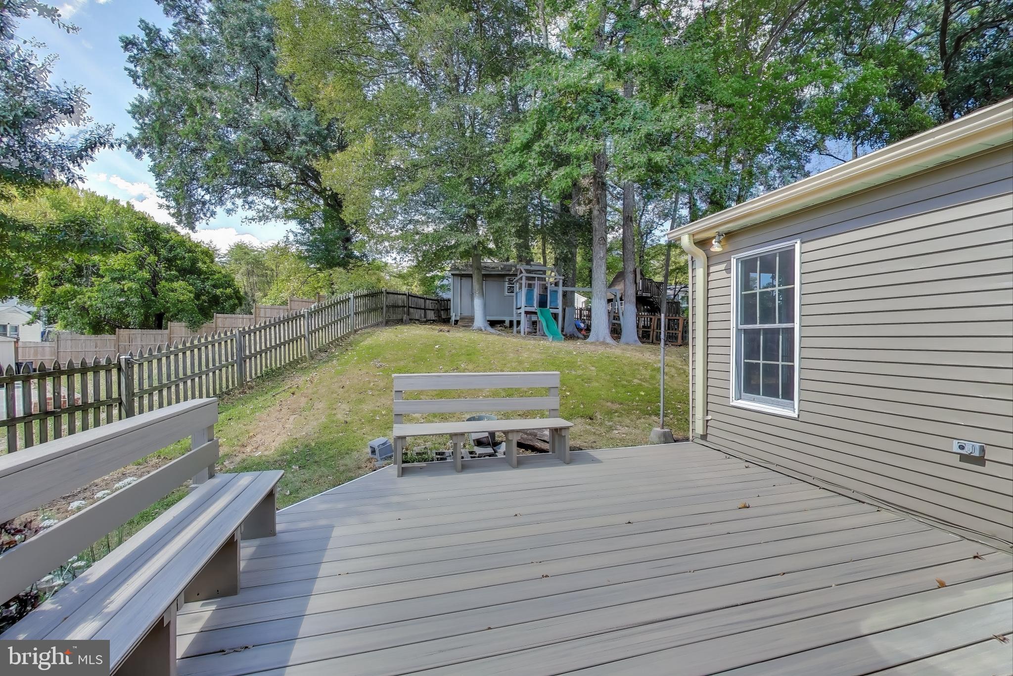 9217 Briarchip Street Laurel, MD 20708 - Photo 33 of 45 a view of a deck with trees