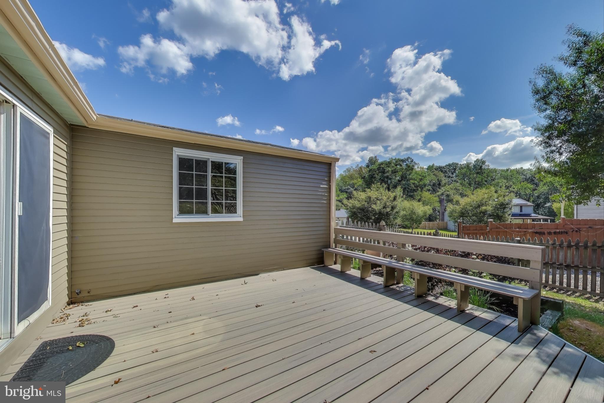 9217 Briarchip Street Laurel, MD 20708 - Photo 34 of 45 a view of a house with a wooden deck