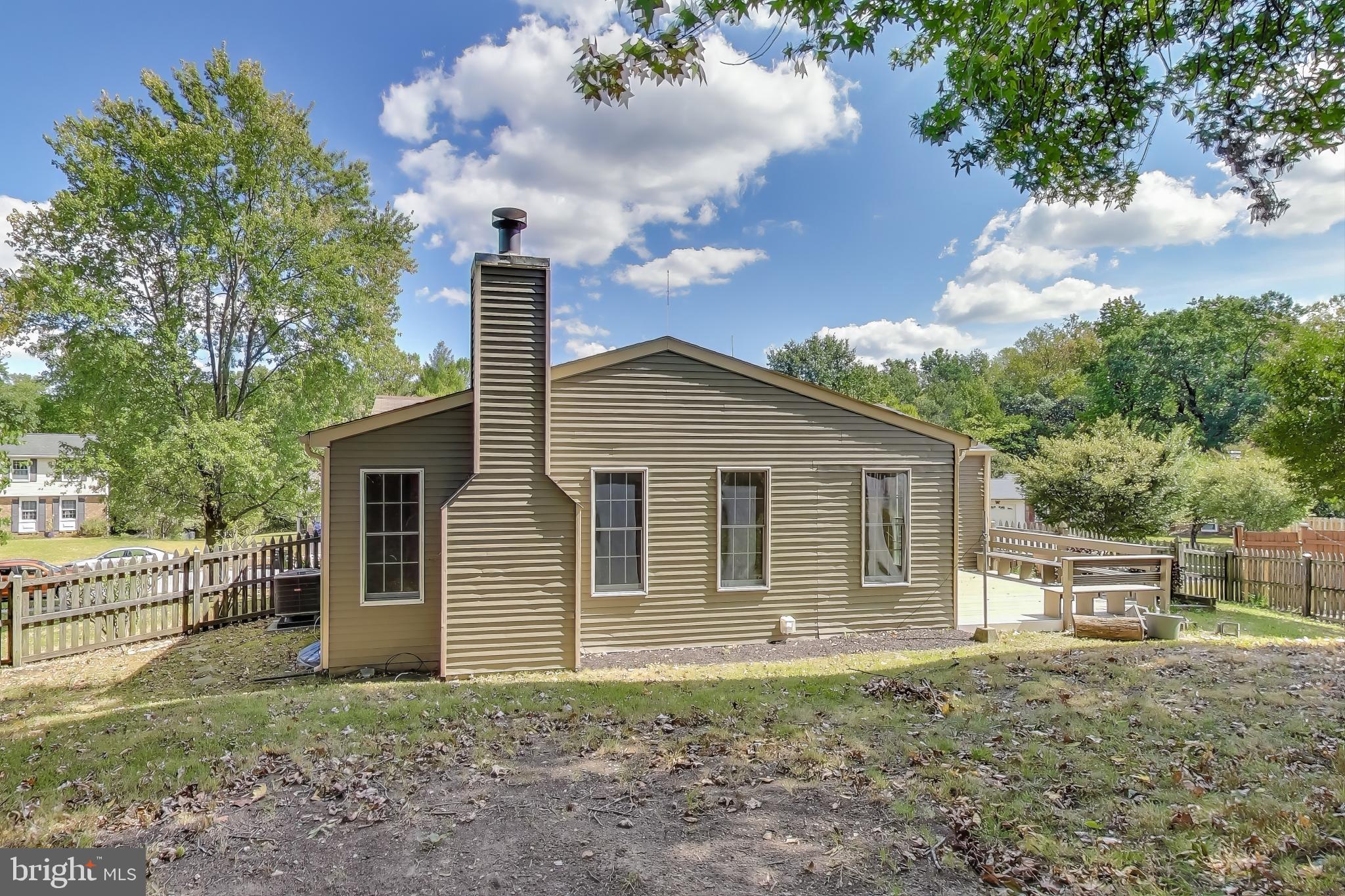 9217 Briarchip Street Laurel, MD 20708 - Photo 36 of 45 a front view of a house with garden
