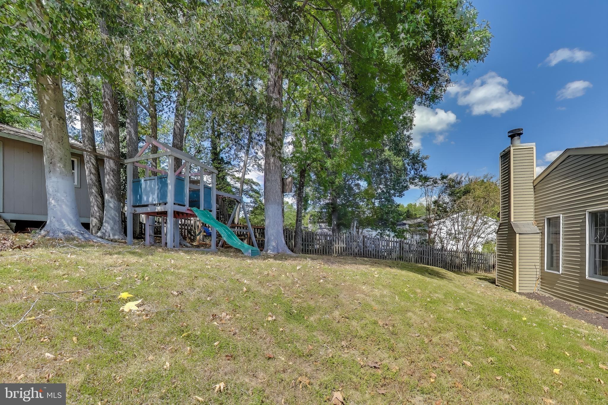 9217 Briarchip Street Laurel, MD 20708 - Photo 39 of 45 a view of a swimming pool with an outdoor seating