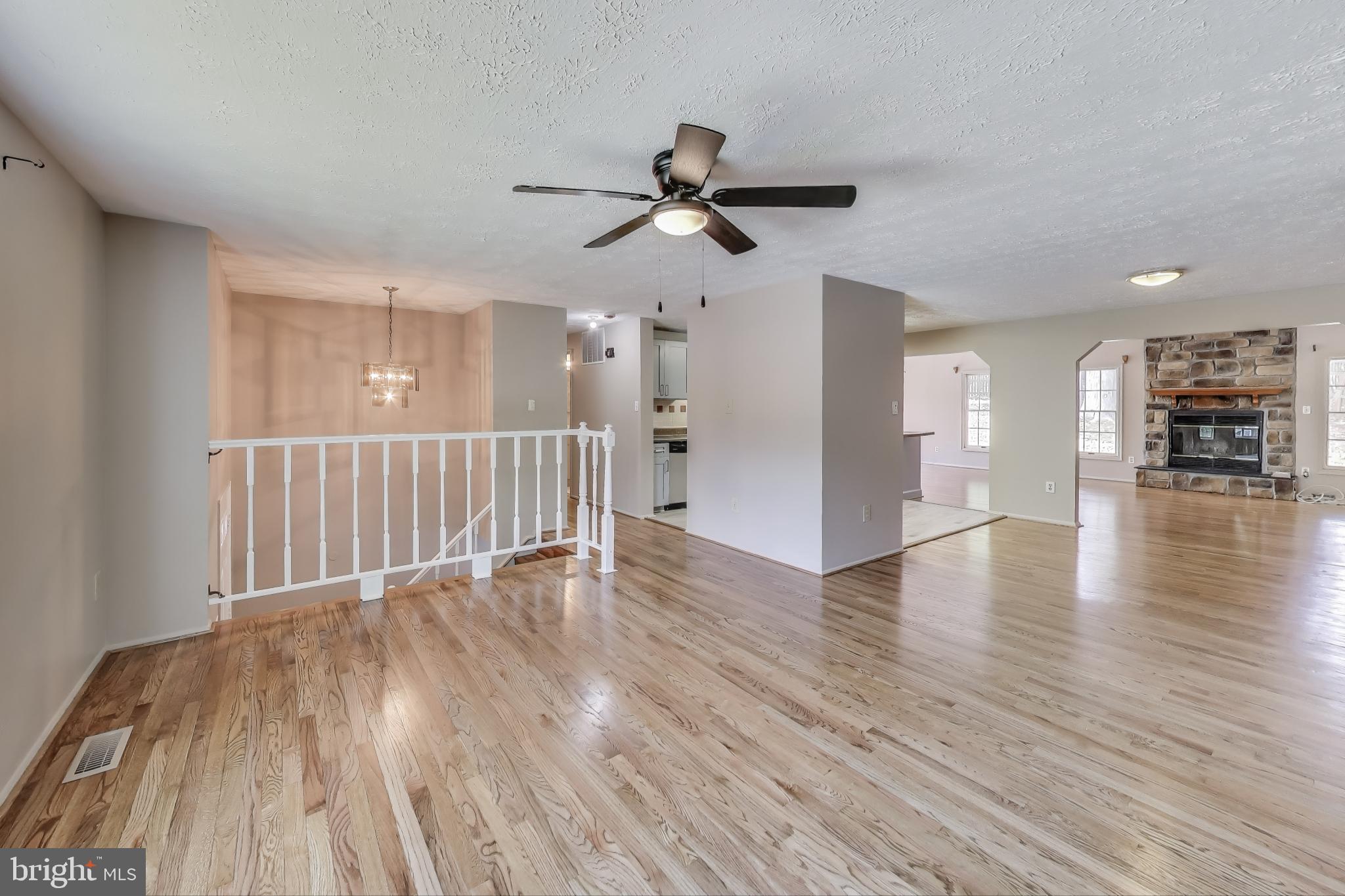 9217 Briarchip Street Laurel, MD 20708 - Photo 6 of 45 a view of an empty room with wooden floor