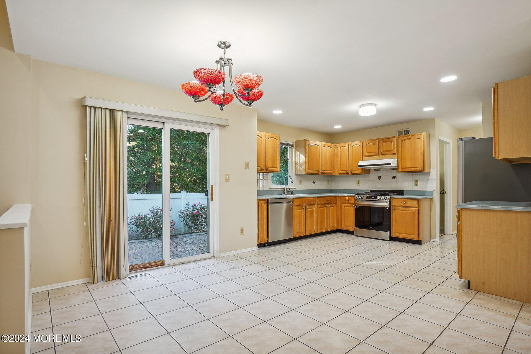 2 Stratton Road Matawan, NJ 07747 - Photo 12 of 34 a kitchen with stainless steel appliances granite countertop a stove a sink and a refrigerator