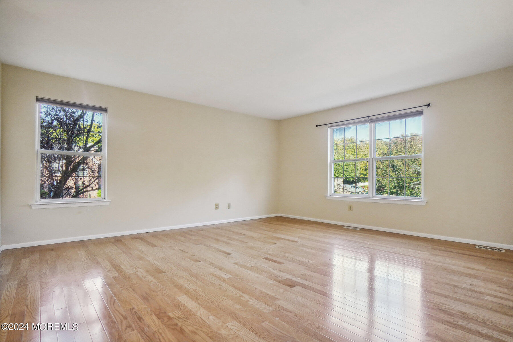 2 Stratton Road Matawan, NJ 07747 - Photo 19 of 34 a view of an empty room with wooden floor and a window