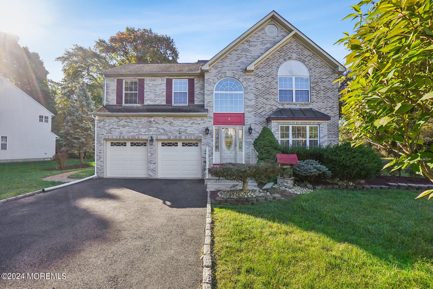 2 Stratton Road Matawan, NJ 07747 - Photo 2 of 34 a front view of a house with a yard and garage