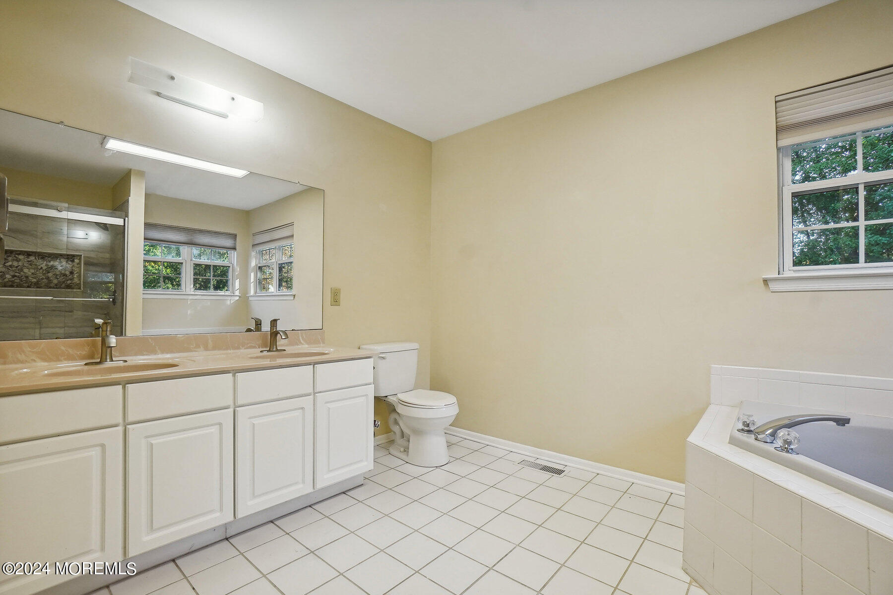 2 Stratton Road Matawan, NJ 07747 - Photo 22 of 34 a bathroom with a toilet sink and mirror