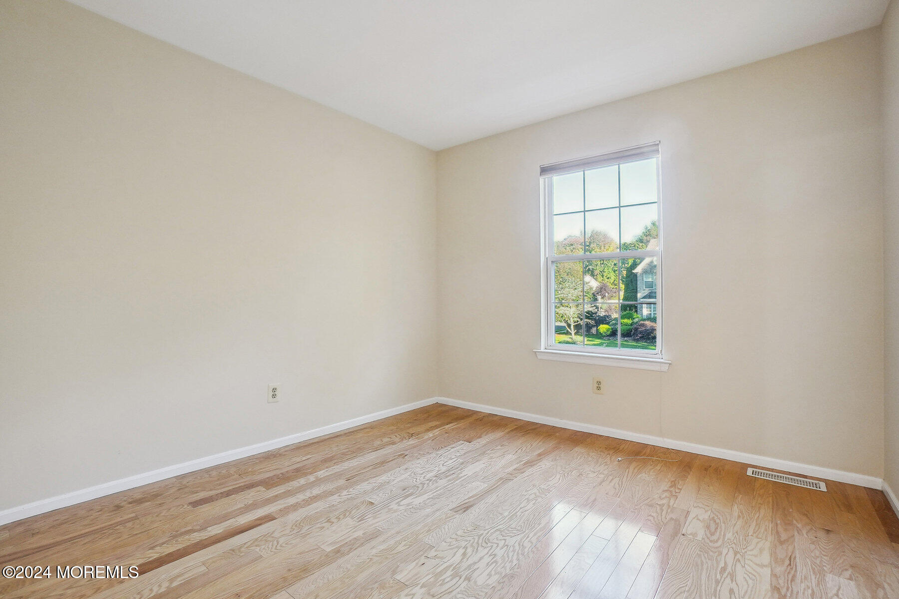 2 Stratton Road Matawan, NJ 07747 - Photo 23 of 34 an empty room with wooden floor and window