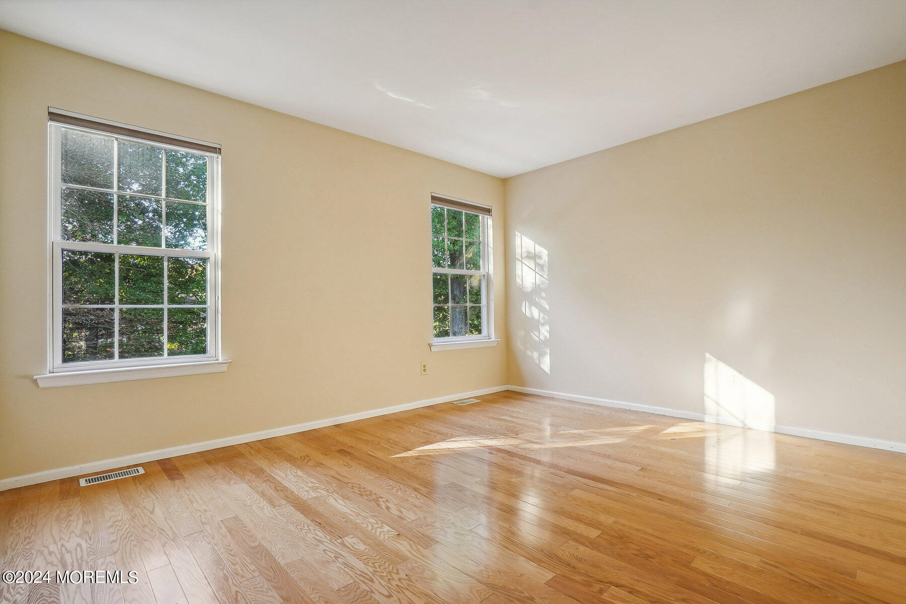 2 Stratton Road Matawan, NJ 07747 - Photo 25 of 34 a view of an empty room with wooden floor and a window