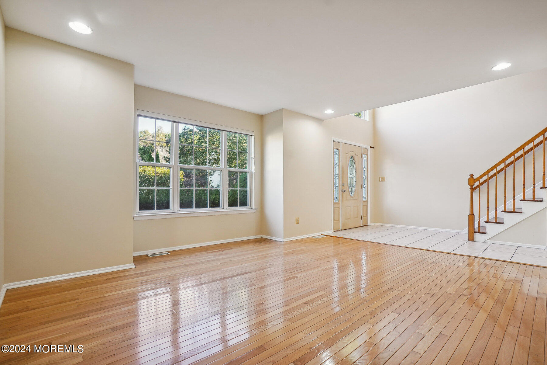 2 Stratton Road Matawan, NJ 07747 - Photo 4 of 34 a view of an empty room with wooden floor and a window