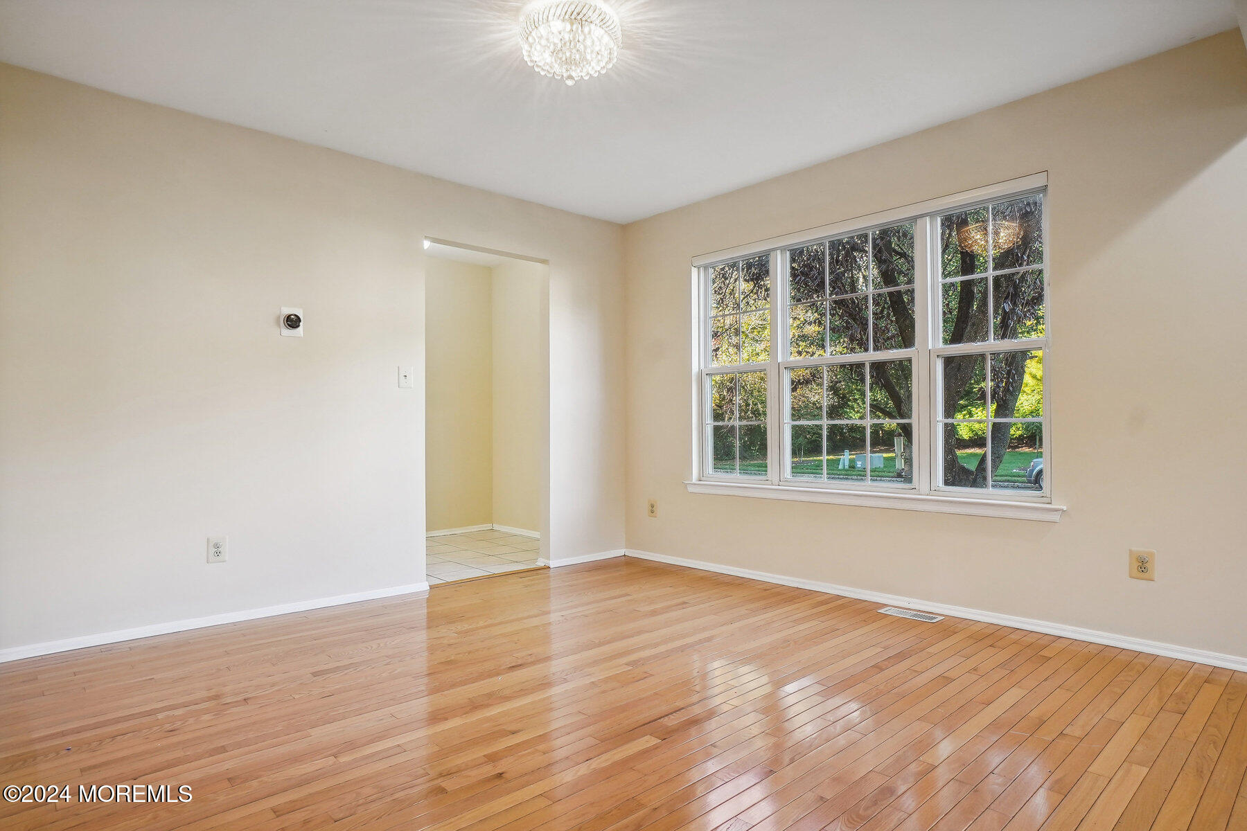 2 Stratton Road Matawan, NJ 07747 - Photo 7 of 34 a view of an empty room with wooden floor and a window