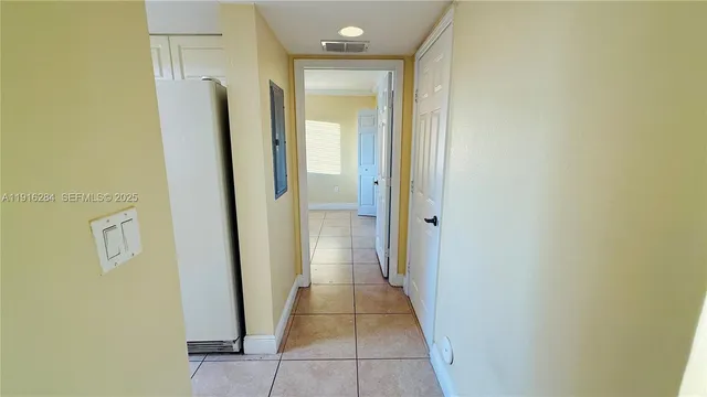 a view of hallway with shower