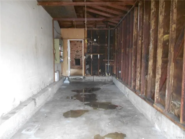 a view of a porch with a table and chairs