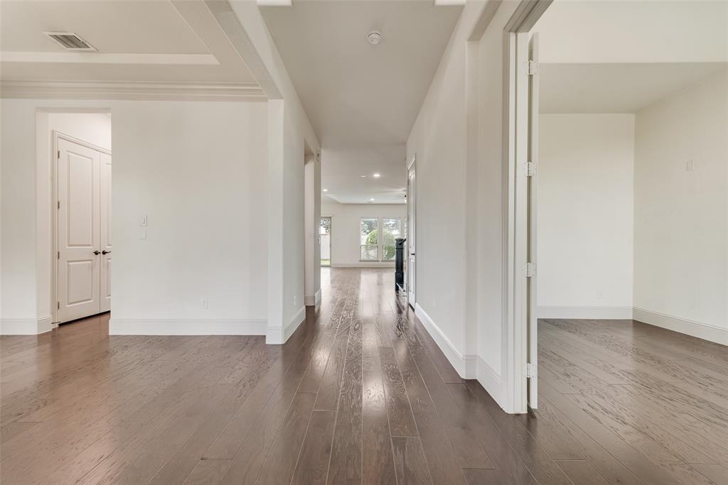 2021 Calisto Way Allen, TX 75013 - Photo 9 of 34 Hallway featuring wood-finish flooring, white walls, and recessed lighting