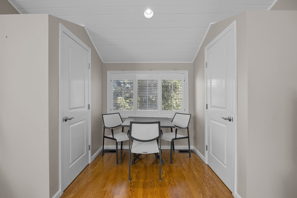 381 Great Oak Road, Unit 9 Mashpee, MA 02649 - Photo 27 of 42 a view of a room with chairs and wooden floor
