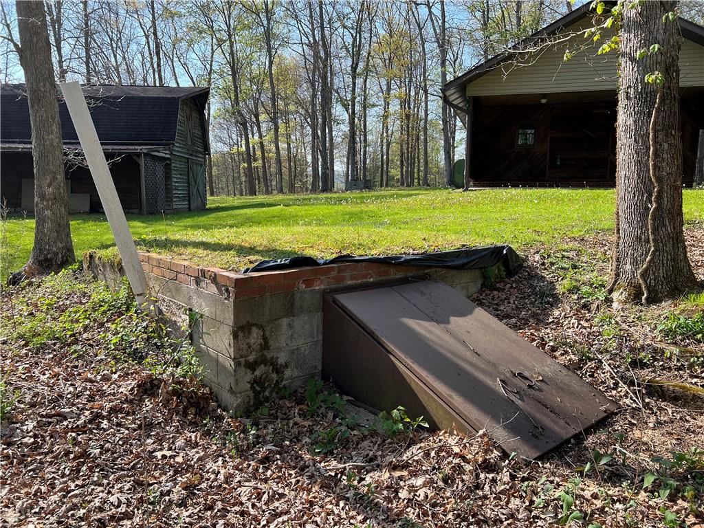 915 Quebec Road Farmington, PA 15437 - Photo 12 of 41 a view of a backyard with a garden