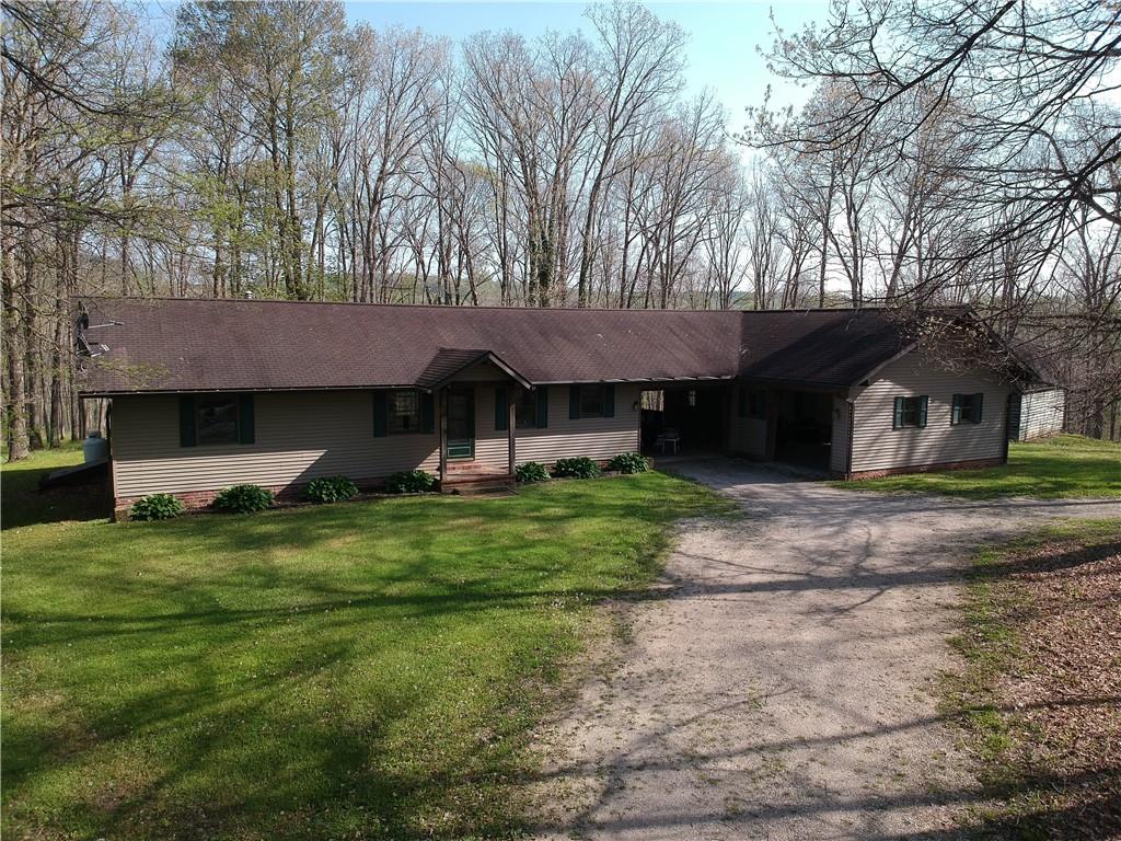 915 Quebec Road Farmington, PA 15437 - Photo 2 of 41 a view of a house with a yard