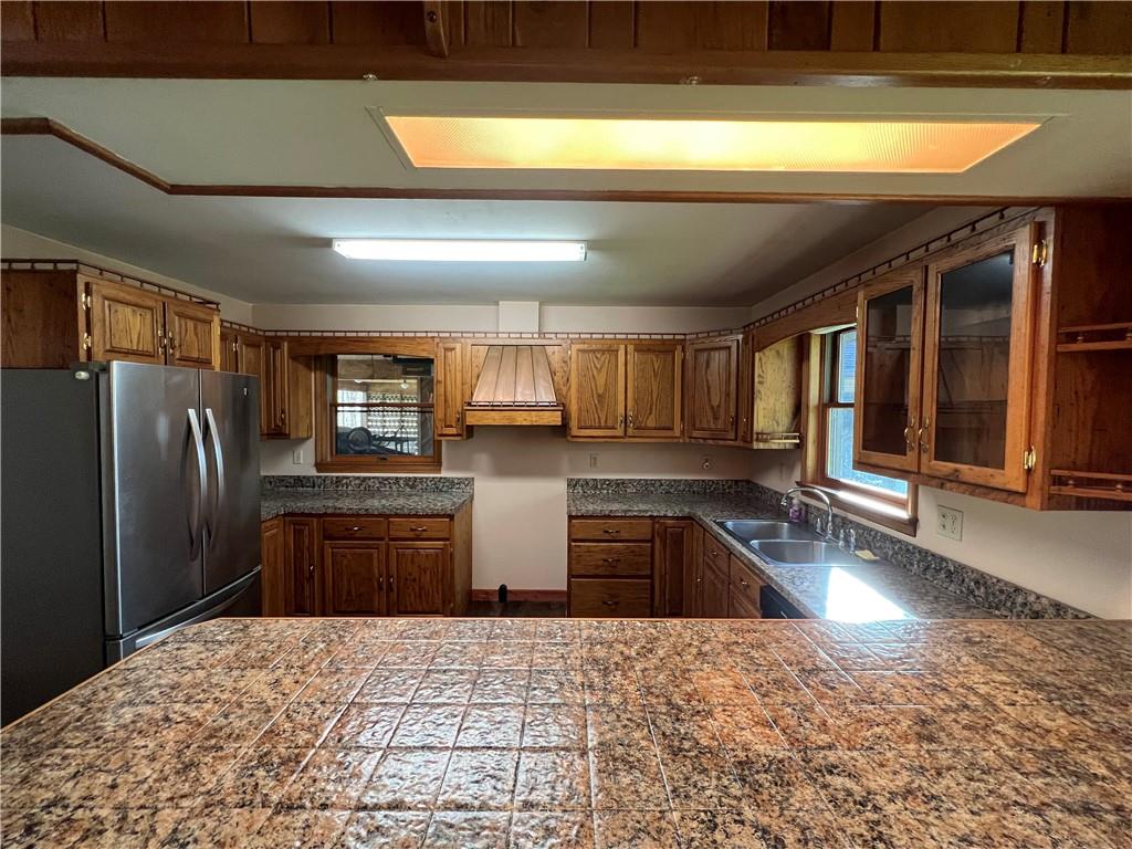915 Quebec Road Farmington, PA 15437 - Photo 24 of 41 a kitchen with stainless steel appliances granite countertop a refrigerator and stove