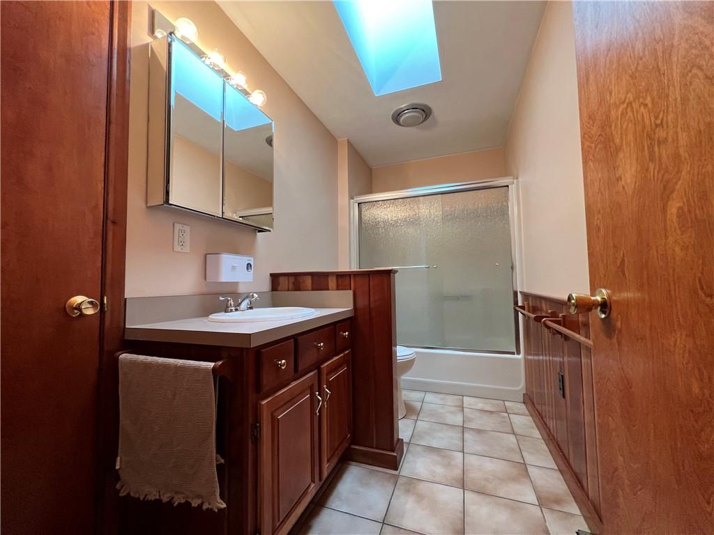 915 Quebec Road Farmington, PA 15437 - Photo 29 of 41 a kitchen with a sink and a refrigerator
