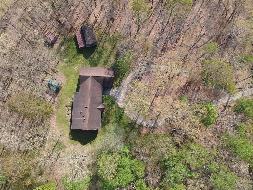 915 Quebec Road Farmington, PA 15437 - Photo 5 of 41 a view of a wooden house with a yard
