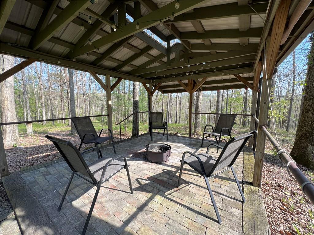 915 Quebec Road Farmington, PA 15437 - Photo 9 of 41 a building outdoor space with patio furniture