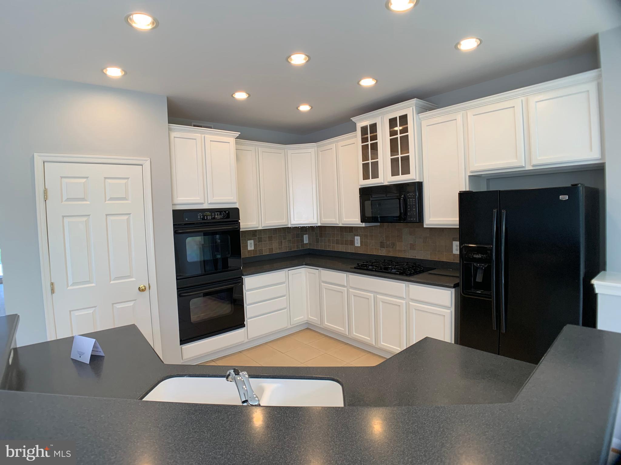 43397 Allisons Ridge Terrace Ashburn, VA 20148 - Photo 9 of 42 Recessed lighted and under cabinet lights too.