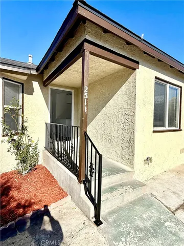 a view of balcony with wooden floor and fence