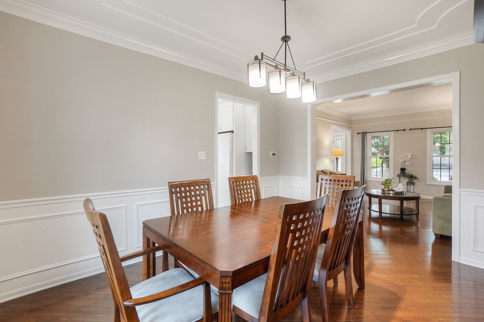 4775 Snapjack Circle Naperville, IL 60564 - Photo 14 of 55 a view of a dining room with furniture wooden floor and chandelier
